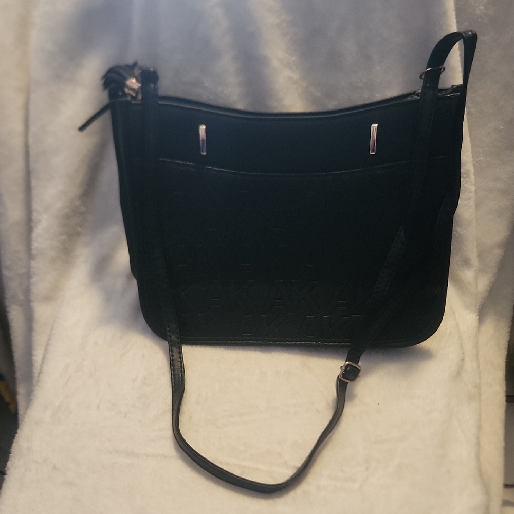 Anne Klein Black Embossed AK Logo Crossbody Handbag Tassel Detail Silver Tone